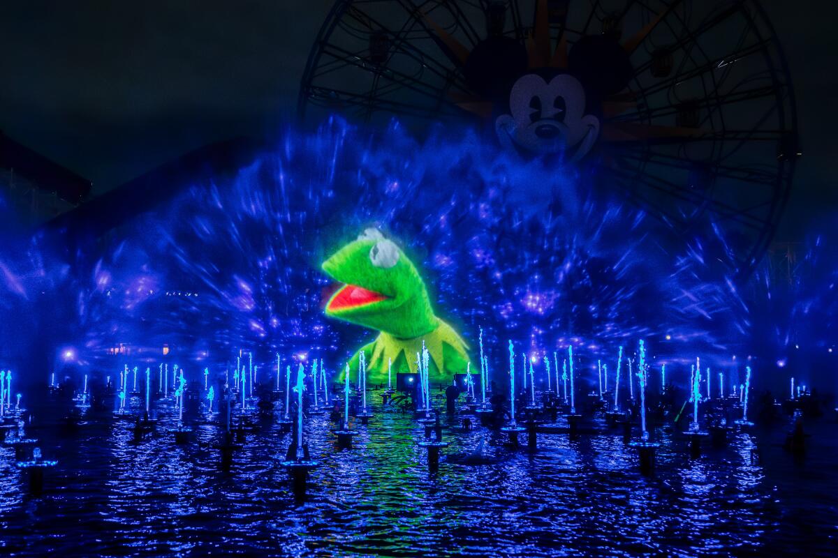 Kermit the Frog projected on water.