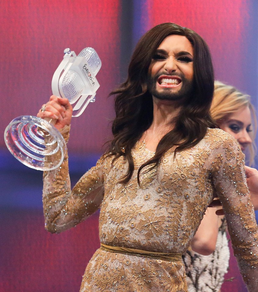 Conchita Wurst, representing Austria, holding the Eurovision Song Contest trophy.