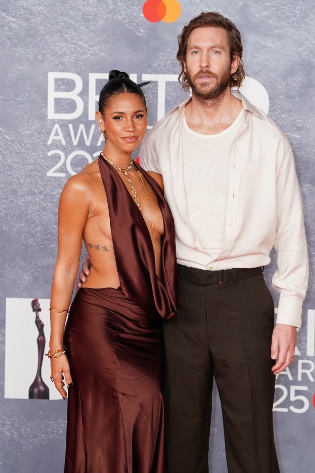 Vick Hope and Calvin Harris at an awards ceremony.