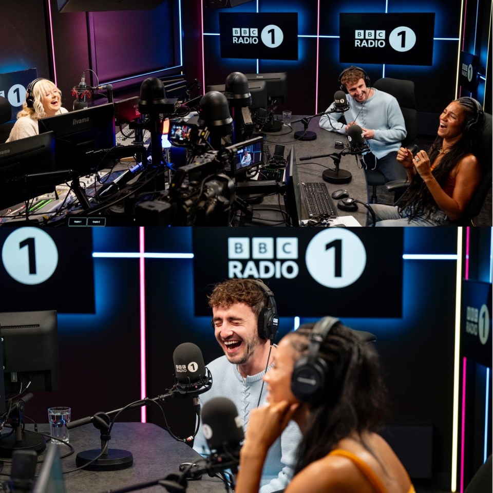 Three radio hosts laughing in a BBC Radio 1 studio.