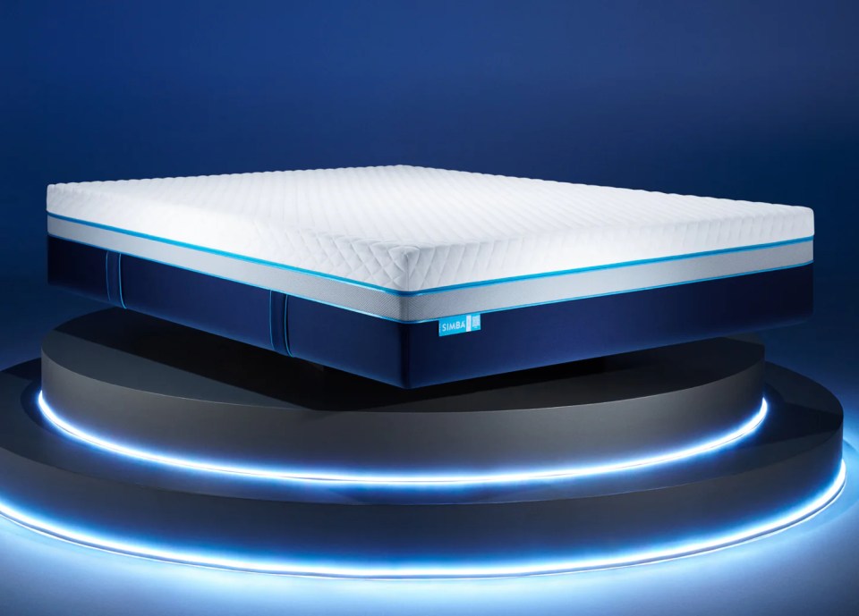 Simba Hybrid Ultra mattress on a platform with blue lighting.