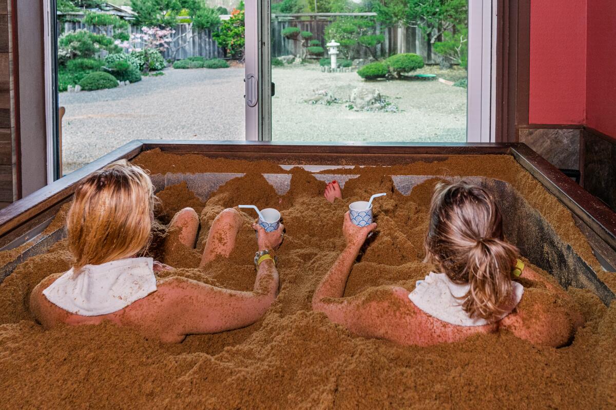 Healdsburg resident Simone Wilson and Wellness Editor Alyssa Bereznak in an enzyme cedar bath at the Osmosis Day Spa.