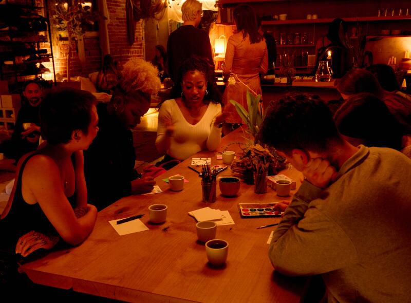 LOS ANGELES -- APRIL 26, 2025: Faith Bakar, Alexsys Hornsby, and Rachel Angelica talking and paintign inside Tea at Shiloh on Saturday, April 26, 2025. (Yasara Gunawardena / For The Times)