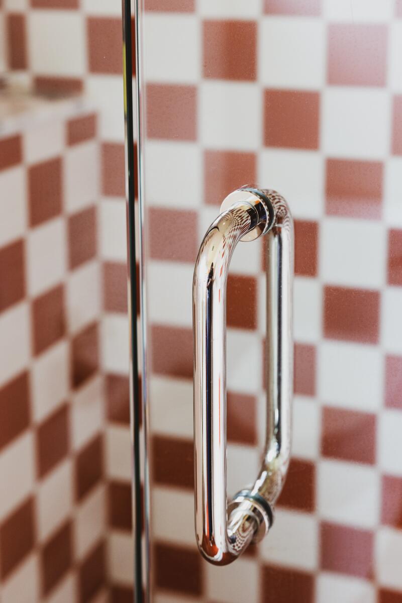 A detail of the shower handle in a room at the River Lodge.