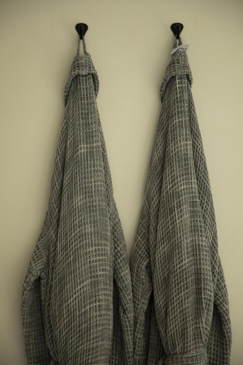 Two robes hang in a room at the Surfrider Malibu.