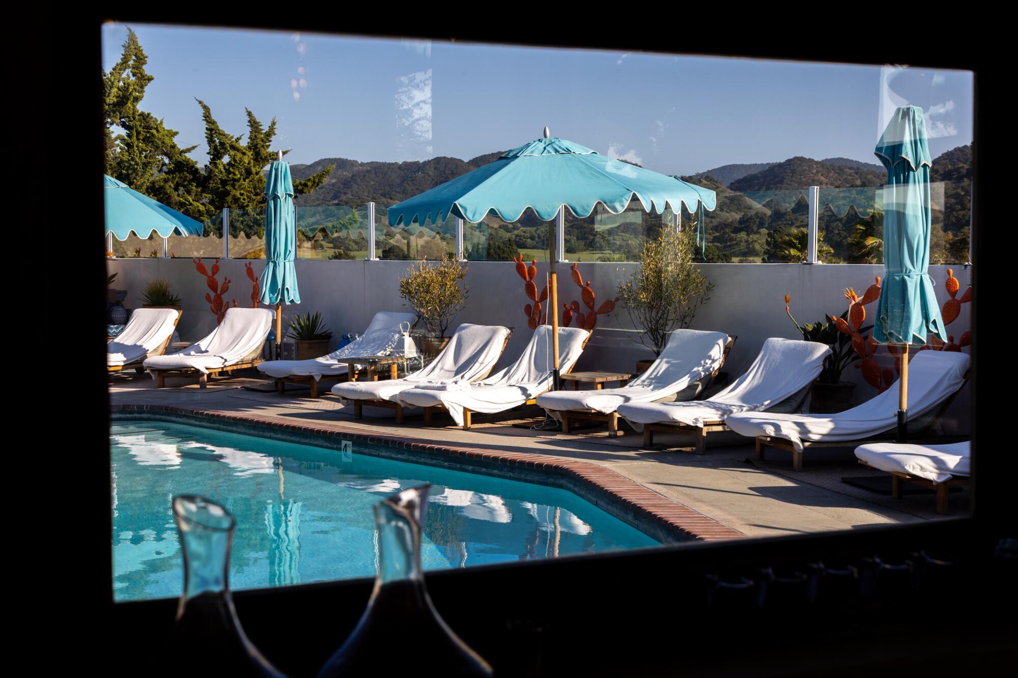 The pool at the Skyview Motel is seen through a window at the Norman restaurant.