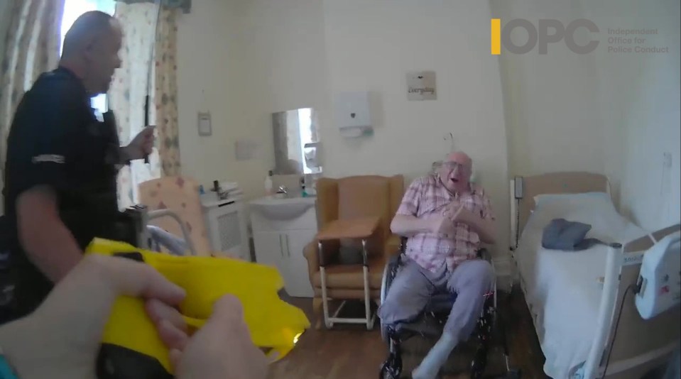 Bodycam footage of police officers using force against a vulnerable elderly man in a wheelchair.