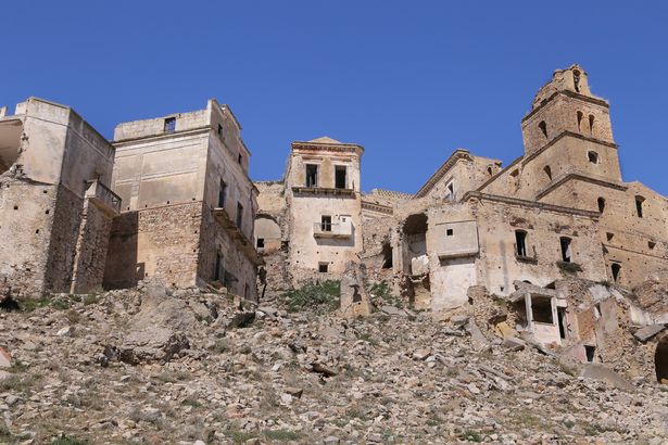 Scenic view of Craco ruins, showing crumbling buildings and rubble