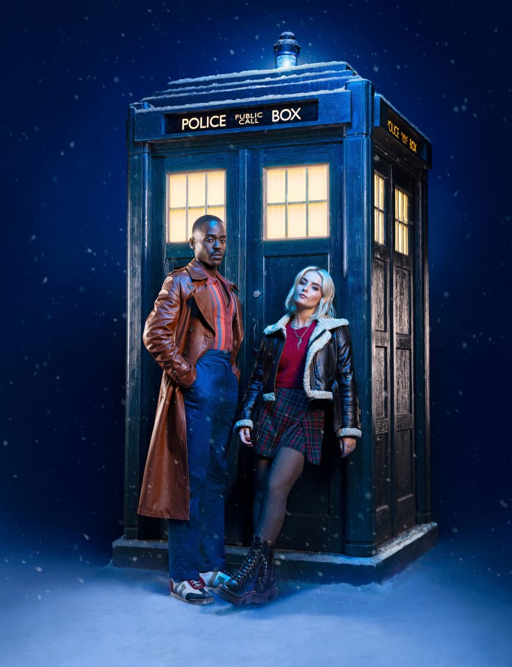 The Doctor and Ruby Sunday stand by the TARDIS in the snow.