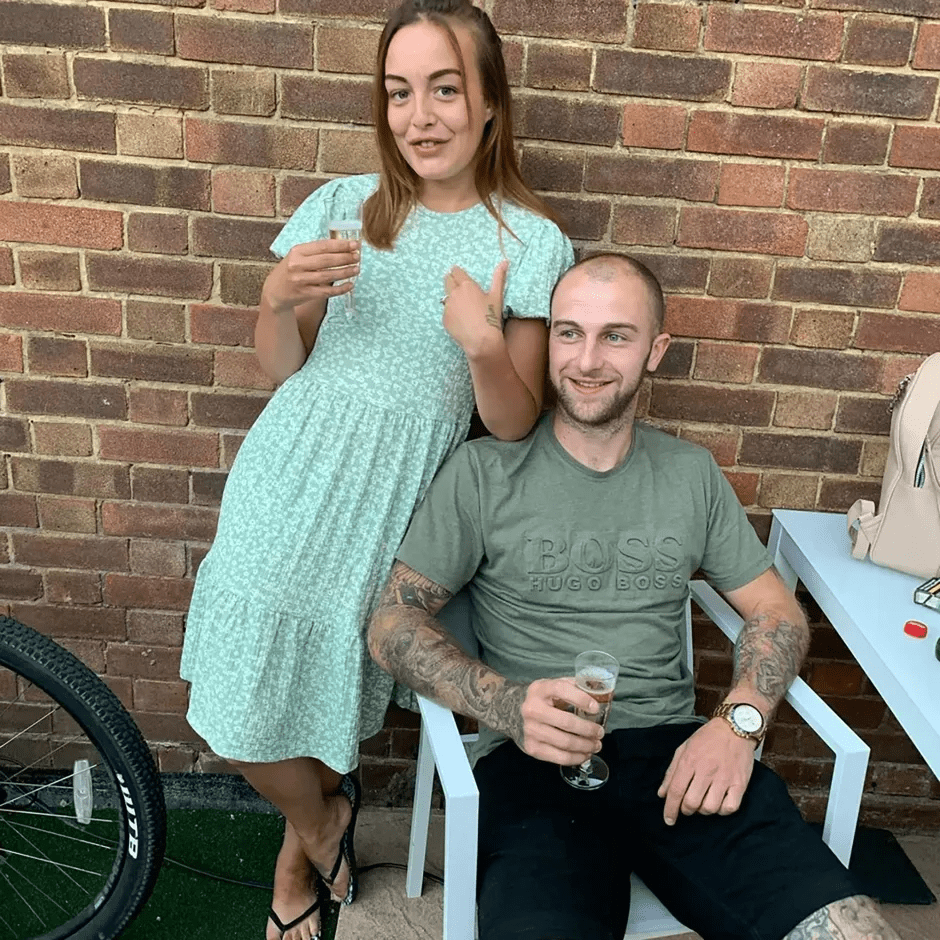 Couple toasting with drinks.