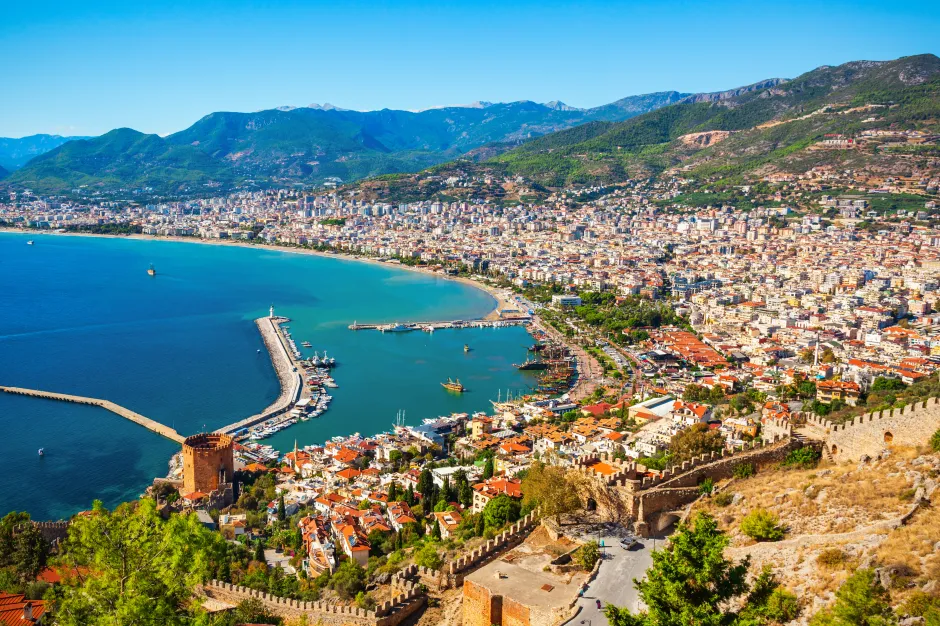Aerial view of Alanya, Turkey, showing the city, harbor, and castle.