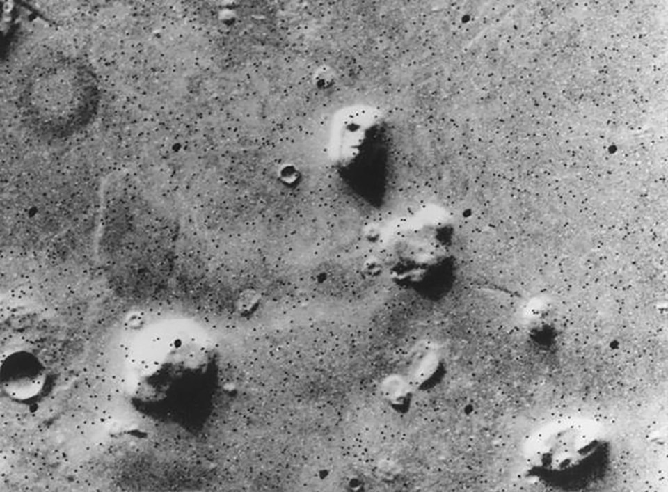 Mars surface image showing formations resembling faces.