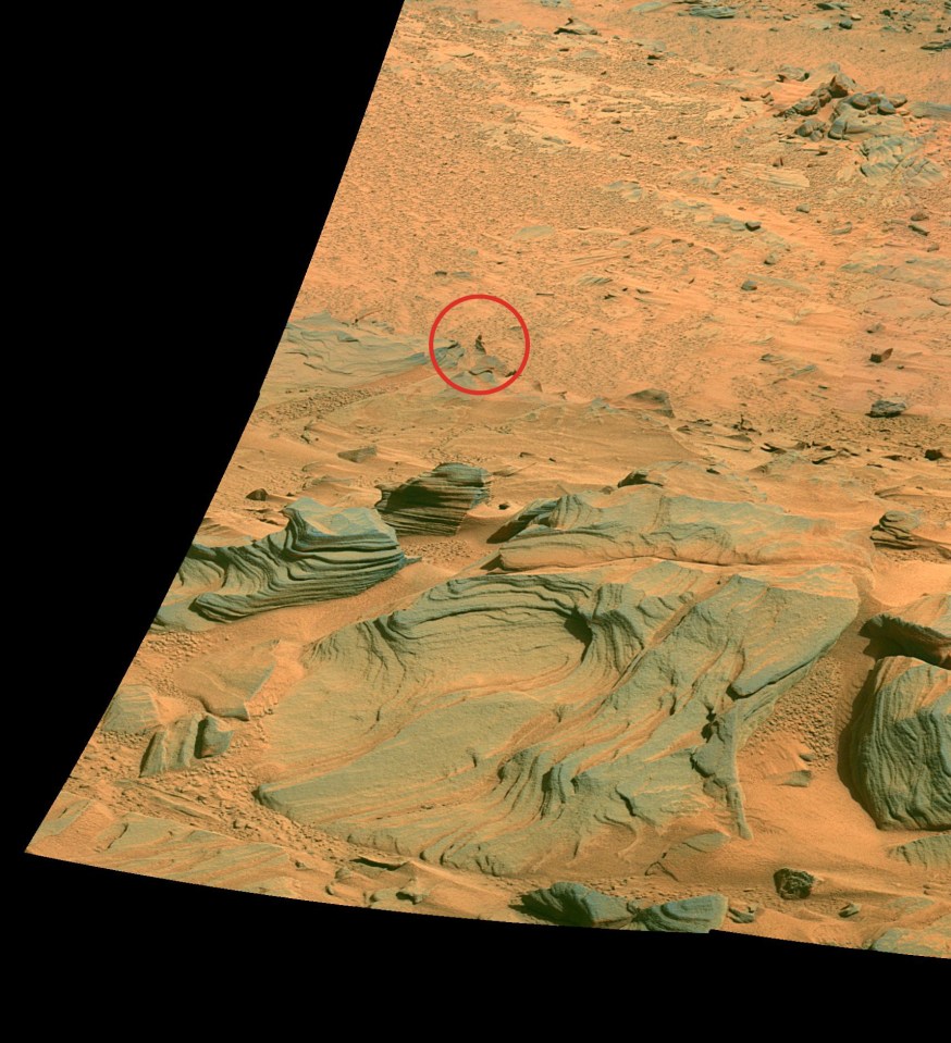 Mars surface with layered rock formations.