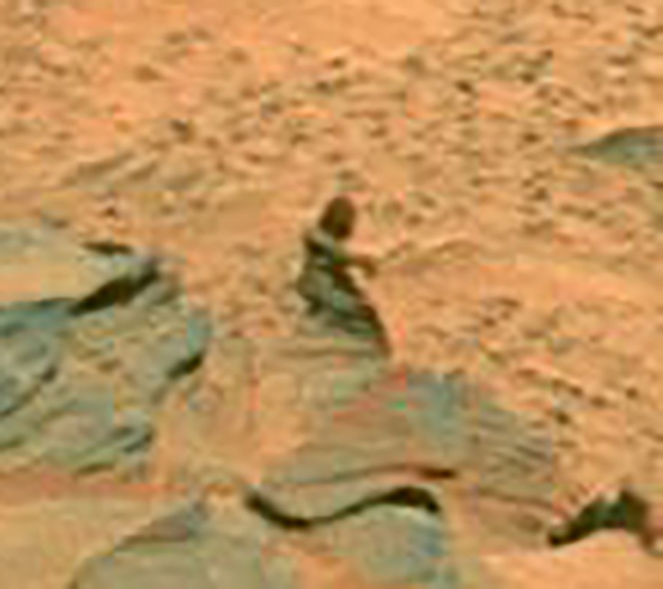 Mars rover image showing rocks and Martian terrain.
