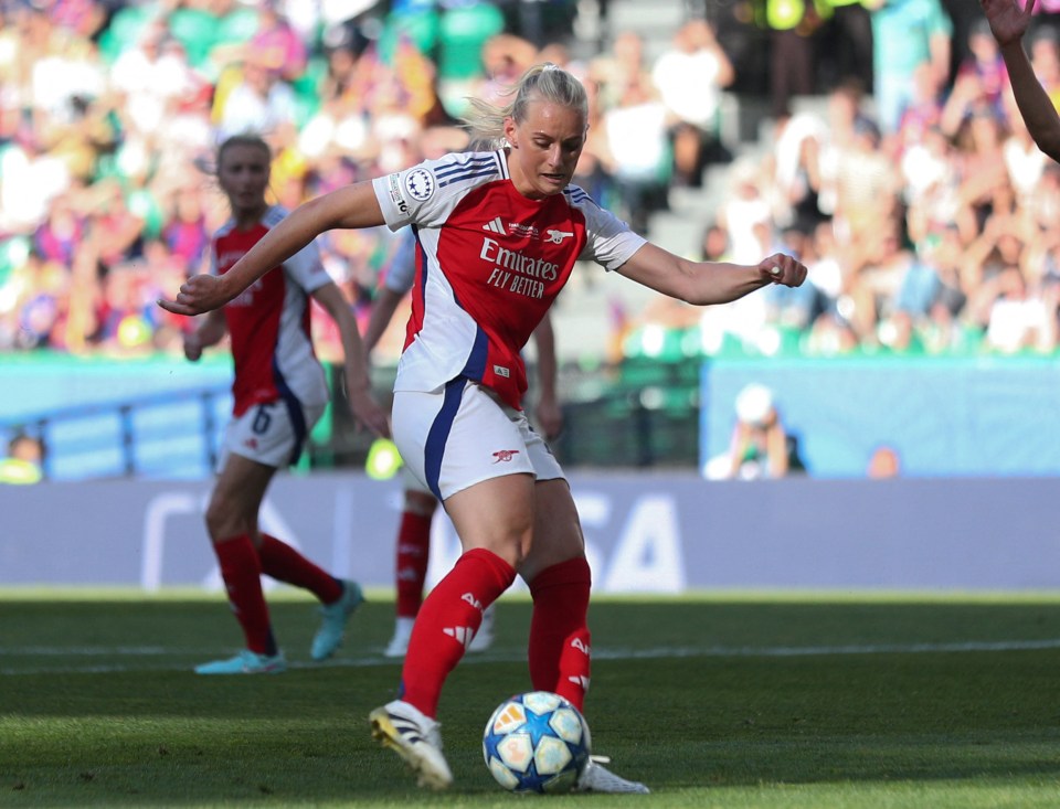 Arsenal's Stina Blackstenius kicking a soccer ball.