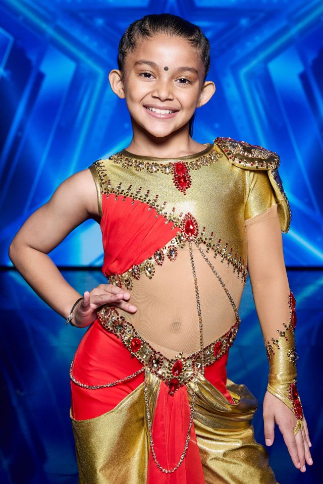 A young girl in a red and gold embellished costume on Britain's Got Talent.