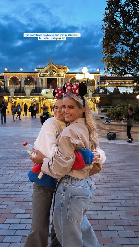 Two women hugging at Disneyland.