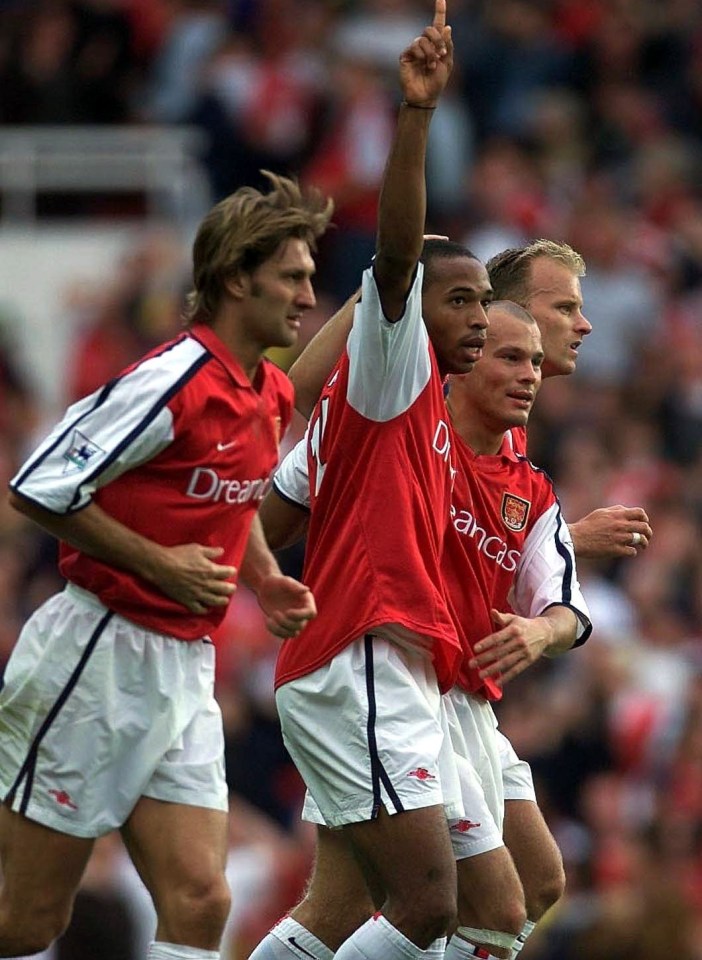 Arsenal players celebrating a goal.