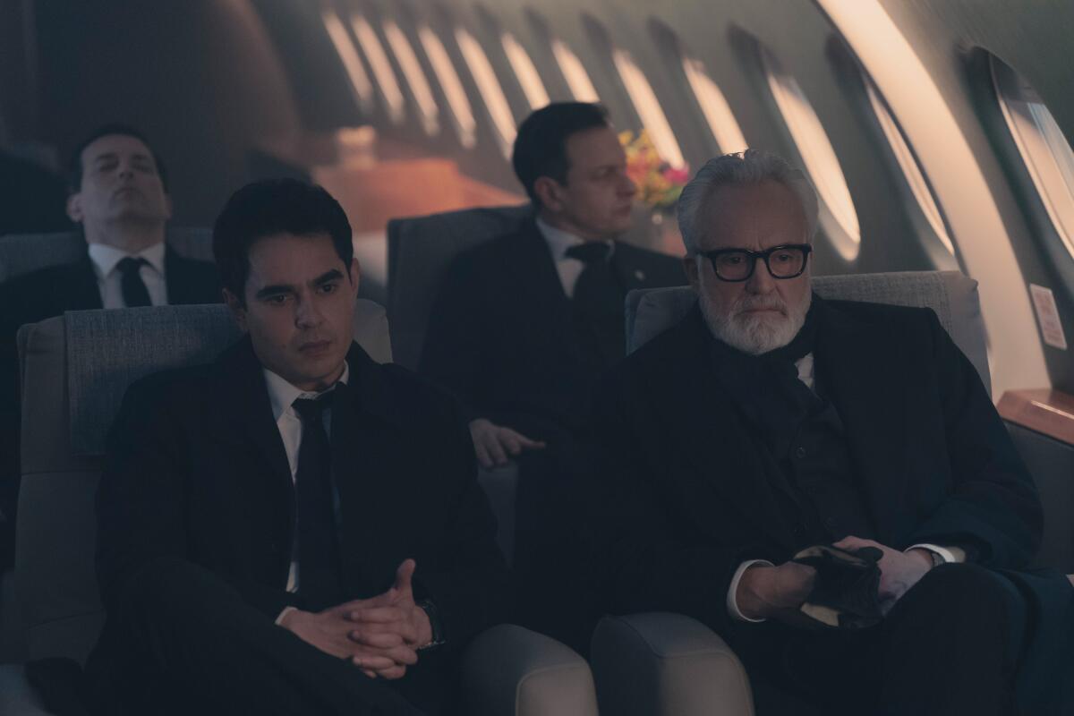 A group of men sit aboard a plane