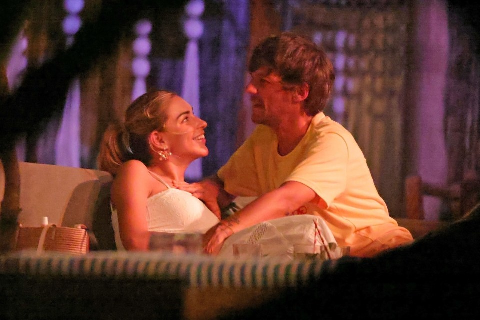 Louis Tomlinson and Zara McDermott embracing at Banana Beach in Costa Rica.