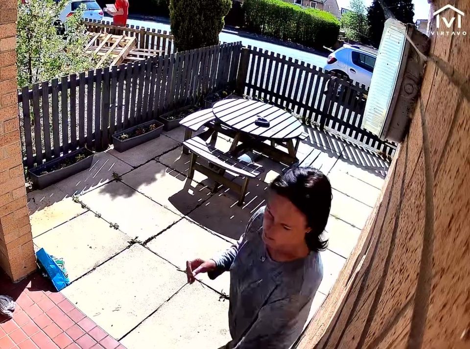 CCTV footage of a woman confronting a postman after her dog was kicked.