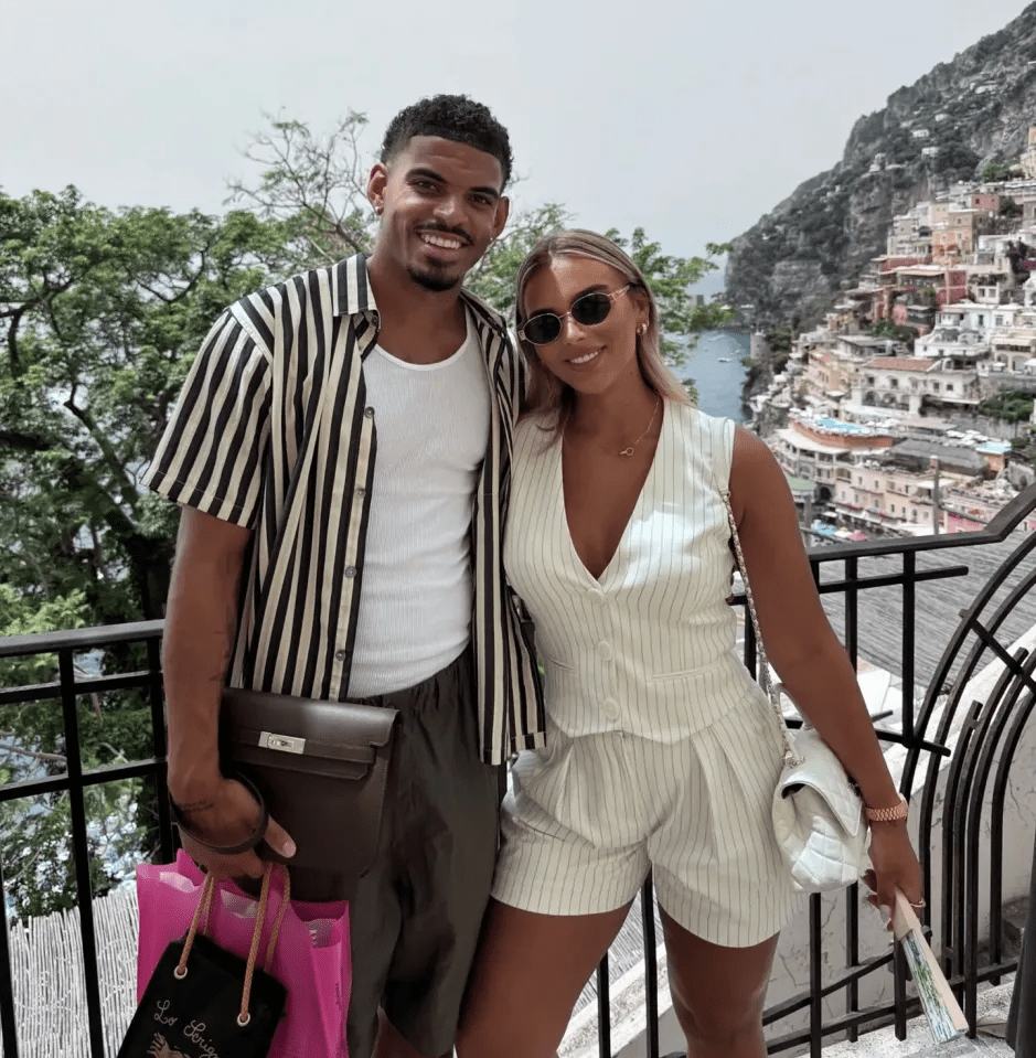 Couple posing in Positano, Italy.