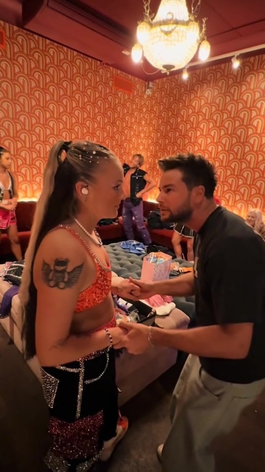 JoJo Siwa and Chris Hughes backstage.