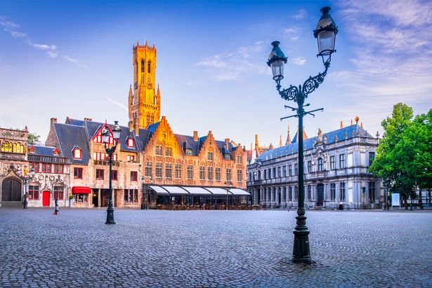 A picture famous Belfry tower and medieval buildings,