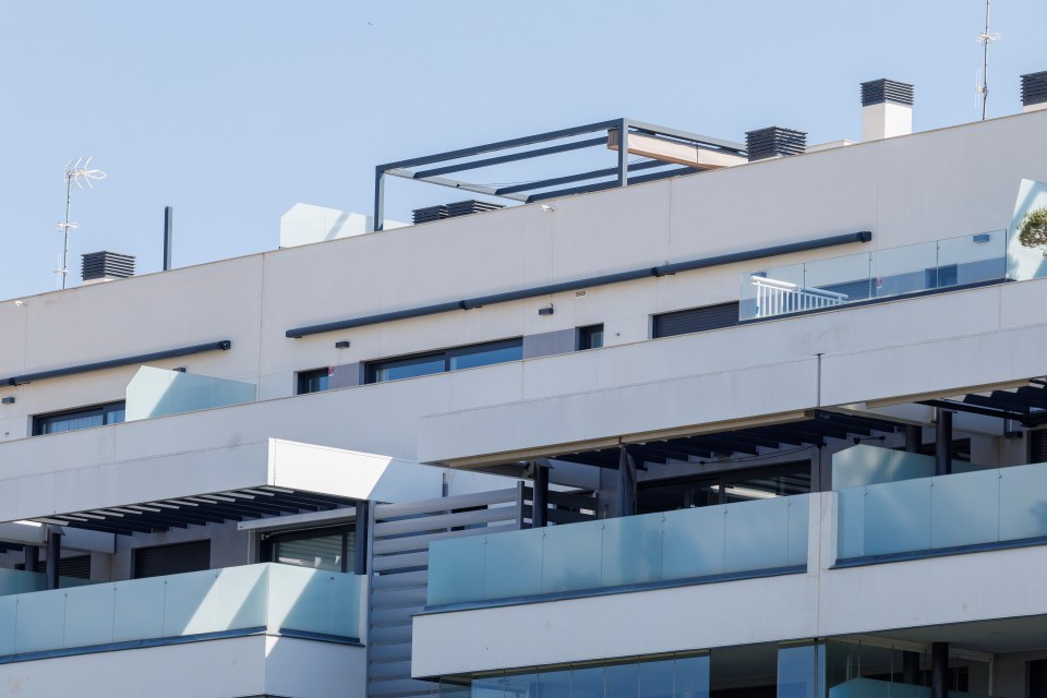 Modern apartment building with balconies.
