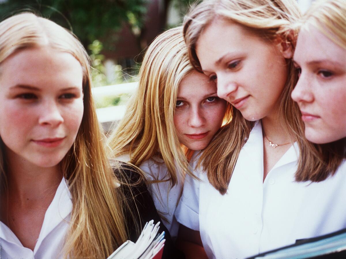 Four blond sisters hang out together.