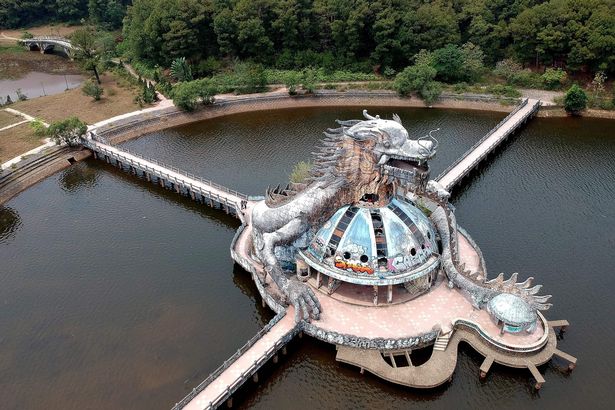 This aerial photograph taken on April 27, 2019 shows the now-abandoned Ho Thuy Tien Waterpark in the central Vietnamese city of Hue. - The graffiti-covered abandoned water park has become an off-the-beaten track attraction in Vietnam's former imperial capital of Hue, drawing tourists from the citys more conventional visitor must-sees like the citadel and ancient tombs. (Photo by Manan VATSYAYANA / AFP)        (Photo credit should read MANAN VATSYAYANA/AFP via Getty Images)
