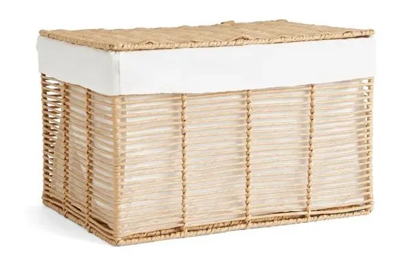 Rectangular woven basket with a white fabric liner.