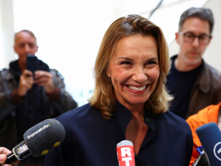 Plaintiff Amelie K reacts as she speaks to members of the media at the courthouse, as the court convicted French actor Gerard Depardieu