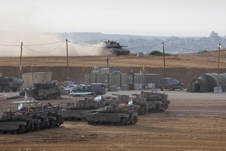 A view shows Israeli military vehicles near the Israel-Gaza border, in Israel, May 16, 2025. REUTERS/Ammar Awad