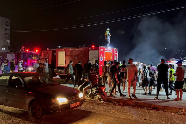 People gather near the site of an Israeli attack in southern Lebanon