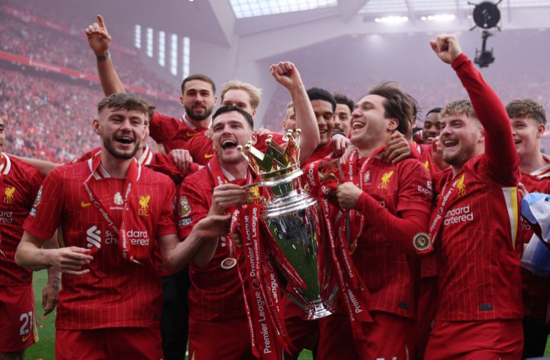 Soccer Football - Premier League - Liverpool v Crystal Palace - Anfield, Liverpool, Britain - May 25, 2025 Liverpool's Andrew Robertson with teammates celebrate with the trophy after winning the Premier League REUTERS/Phil Noble EDITORIAL USE ONLY. NO USE WITH UNAUTHORIZED AUDIO, VIDEO, DATA, FIXTURE LISTS, CLUB/LEAGUE LOGOS OR 'LIVE' SERVICES. ONLINE IN-MATCH USE LIMITED TO 120 IMAGES, NO VIDEO EMULATION. NO USE IN BETTING, GAMES OR SINGLE CLUB/LEAGUE/PLAYER PUBLICATIONS. PLEASE CONTACT YOUR ACCOUNT REPRESENTATIVE FOR FURTHER DETAILS..
