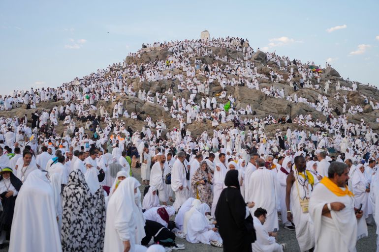 Muslim pilgrims gather at the top of the rocky hill known as the Mountain of Mercy, on the Plain of Arafat, during the annual Hajj pilgrimage, near the holy city of Mecca, Saudi Arabia, Saturday, June 15