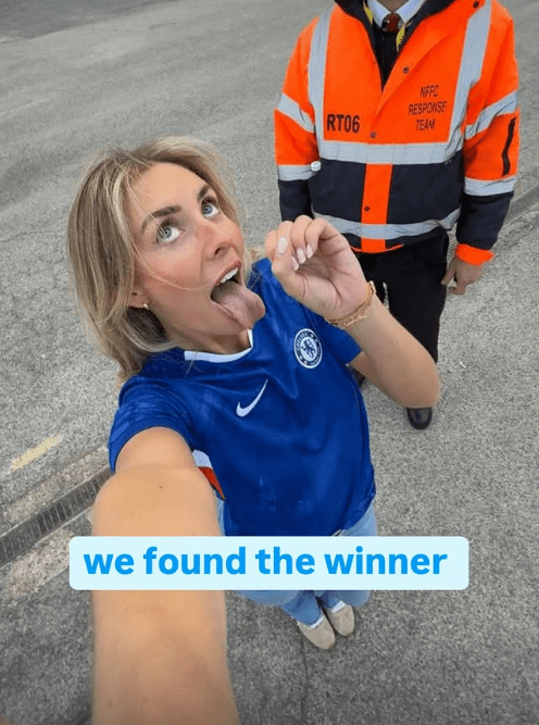 Woman in Chelsea jersey sticking out tongue; text overlay: "we found the winner"