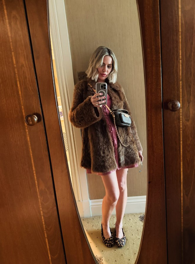 Sally Carman of Coronation Street taking a selfie in a mirror.