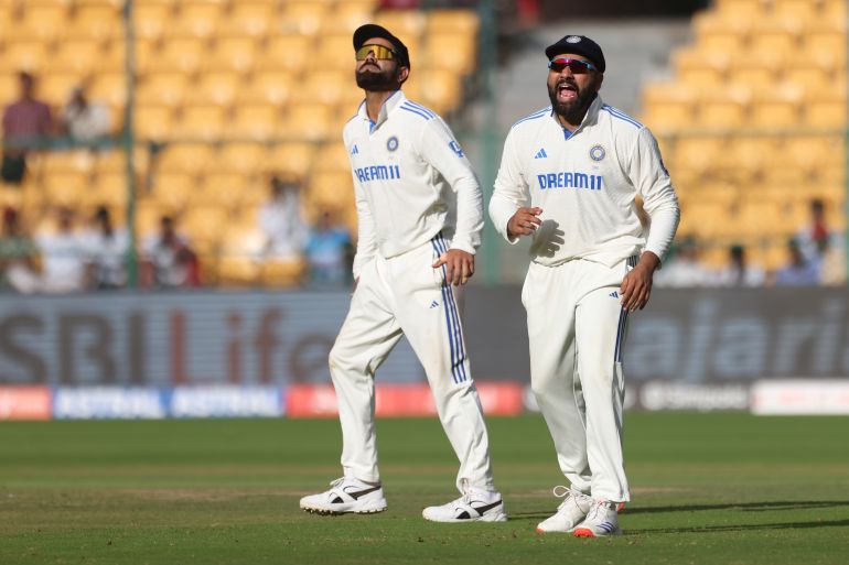 Virat Kohli and Rohit Sharma react.,