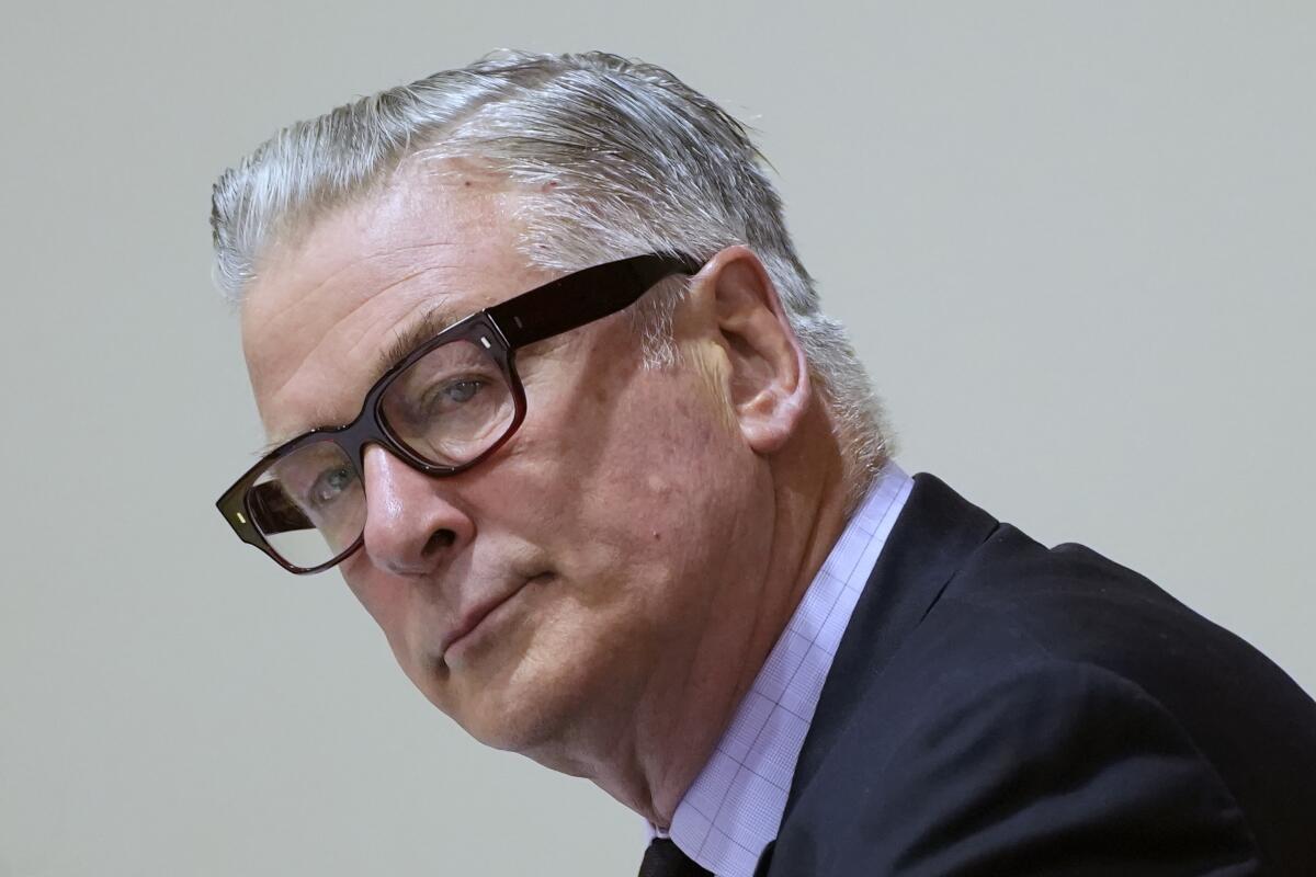 Alec Baldwin turns his head in court