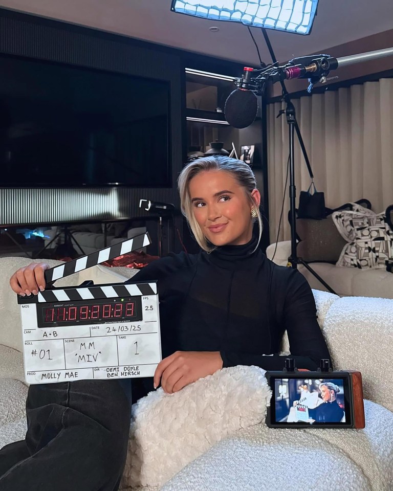 Molly Mae holding a clapperboard; next three episodes of her show air May 9th.