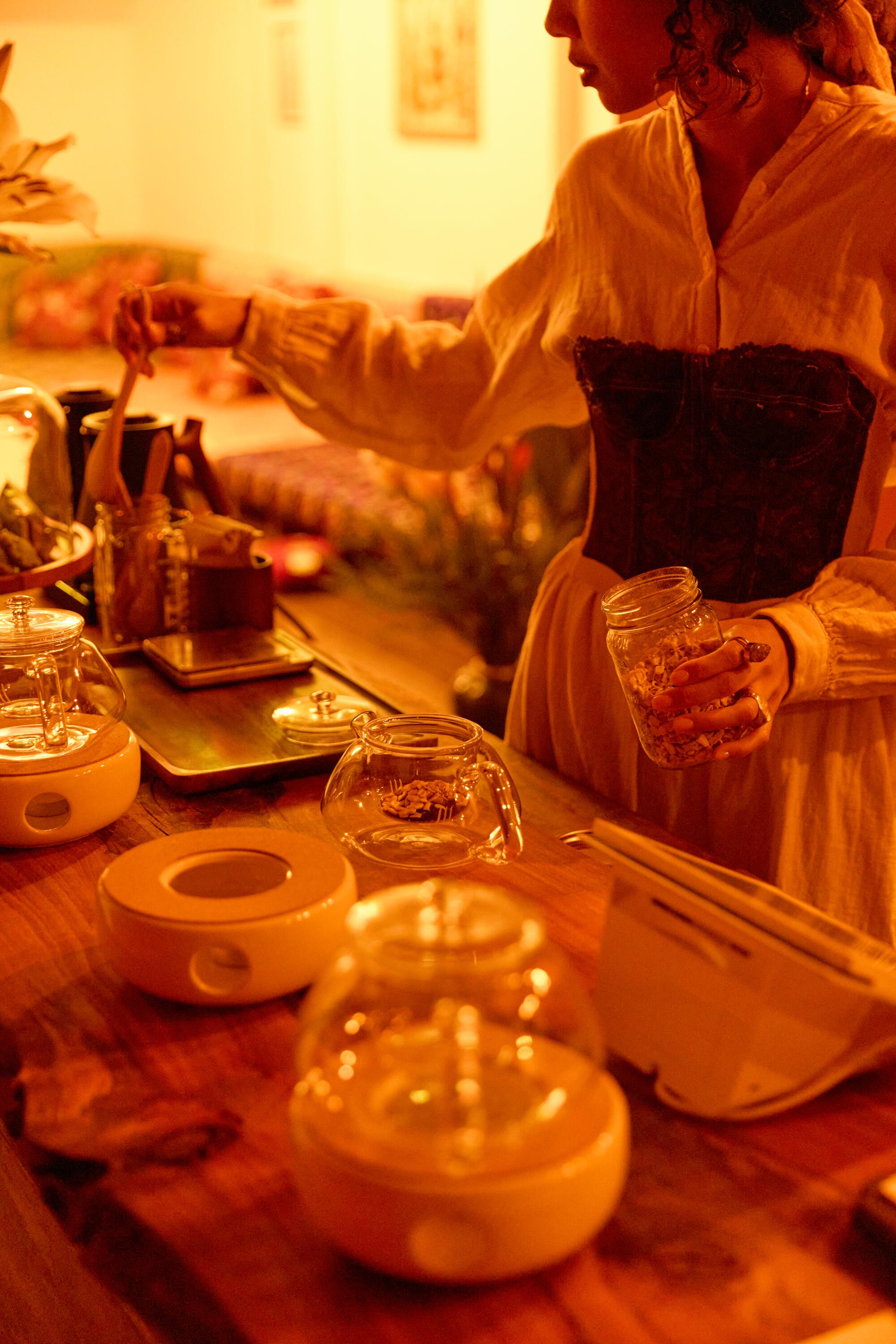 Jai Tea Loft owner Salanya Angel Inm prepares tea at her recently opened social gathering space in Koreatown.