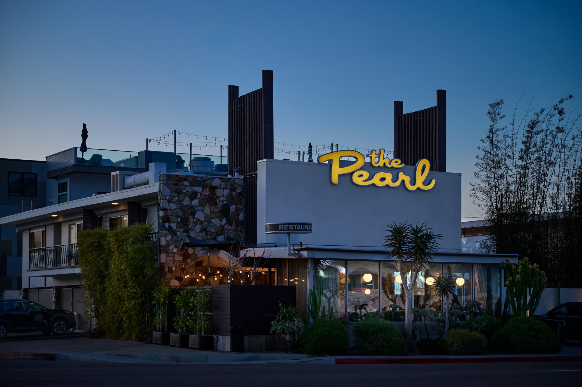 The cursive yellow sign at the Pearl reverberates with ’50s vibes.