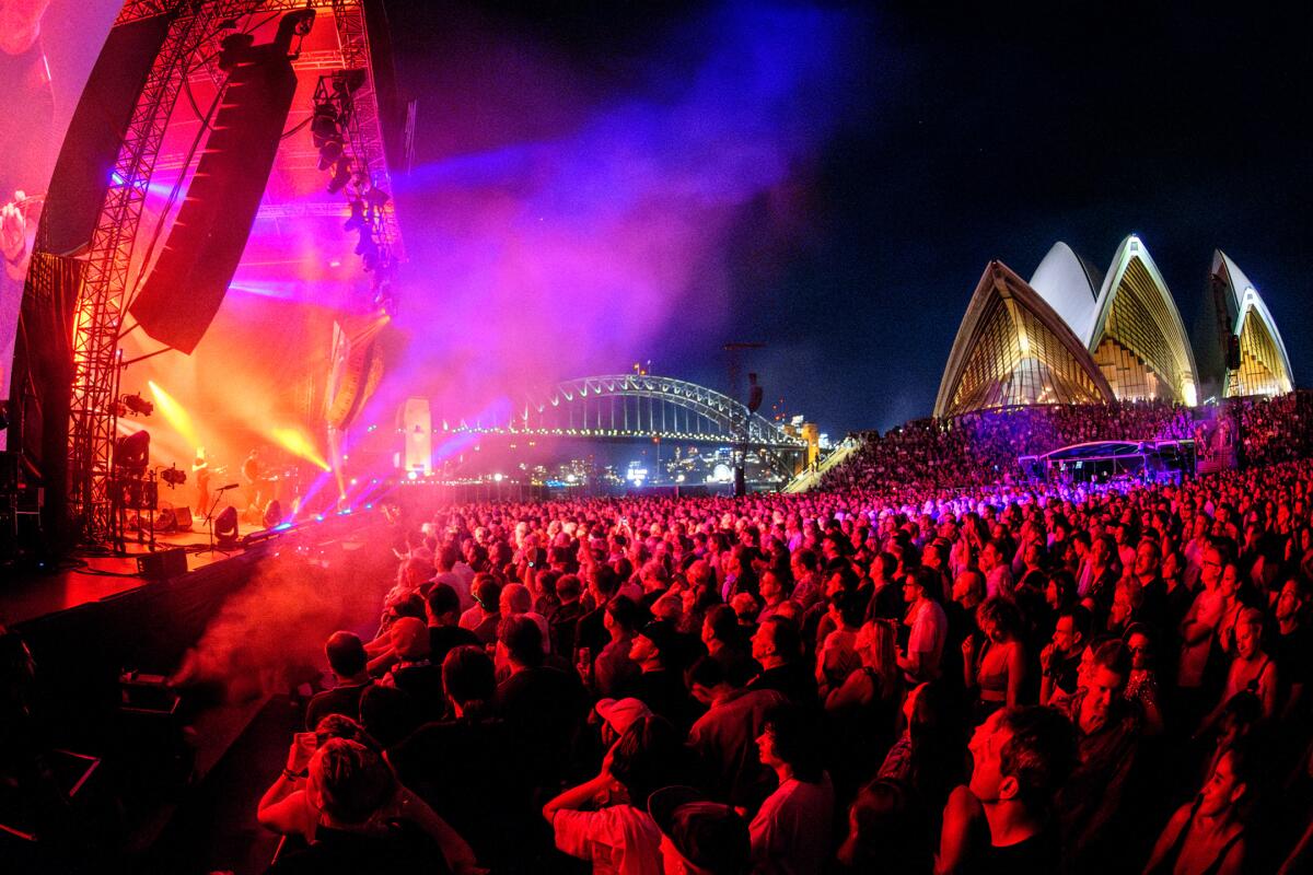 New Order performs in front of a full crowd in Sydney, Australia.