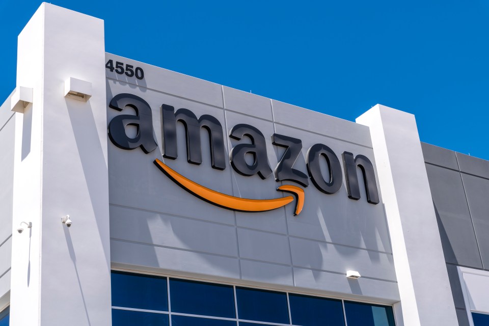 Amazon logo on a fulfillment center building.