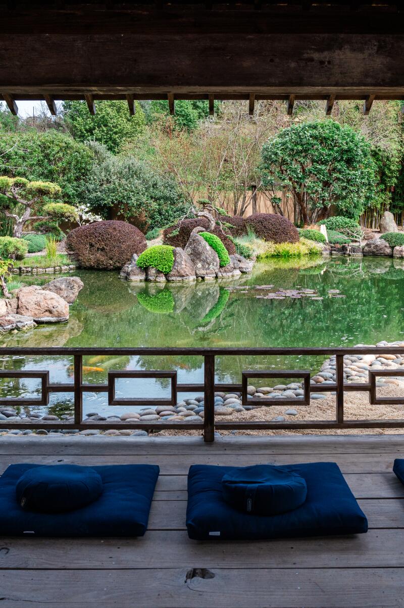 FREESTONE, CA -- MARCH 29, 2025: Sitting area at Kyoto-style Meditation Garden. Wellness Editor Alyssa Bereznak in an enzyme cedar bath at the Osmosis Day Spa in Freestone, California on Saturday, March 29, 2025. (Andri Tambunan / For The Times)