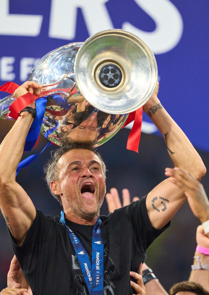 Luis Enrique, PSG manager, lifting the UEFA Champions League trophy.