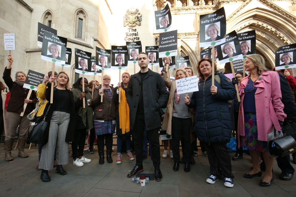 Protestors holding signs that say "Free Sally Challen" outside the Royal Courts of Justice.