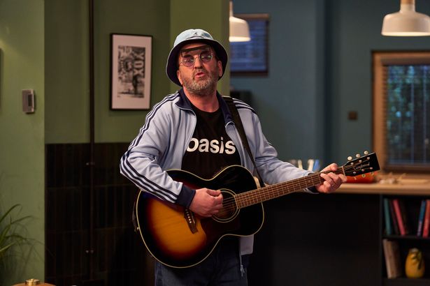 Lee Mack in an Oasis t-shirt